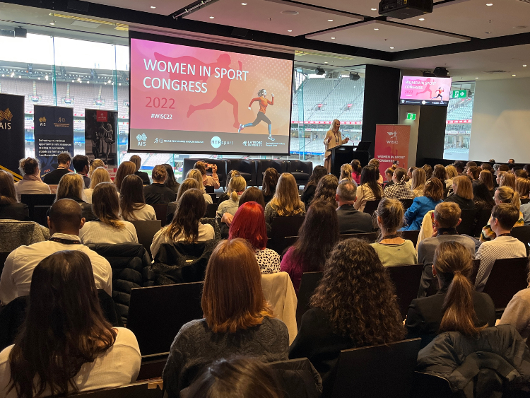 Audience listening to MC speak at event