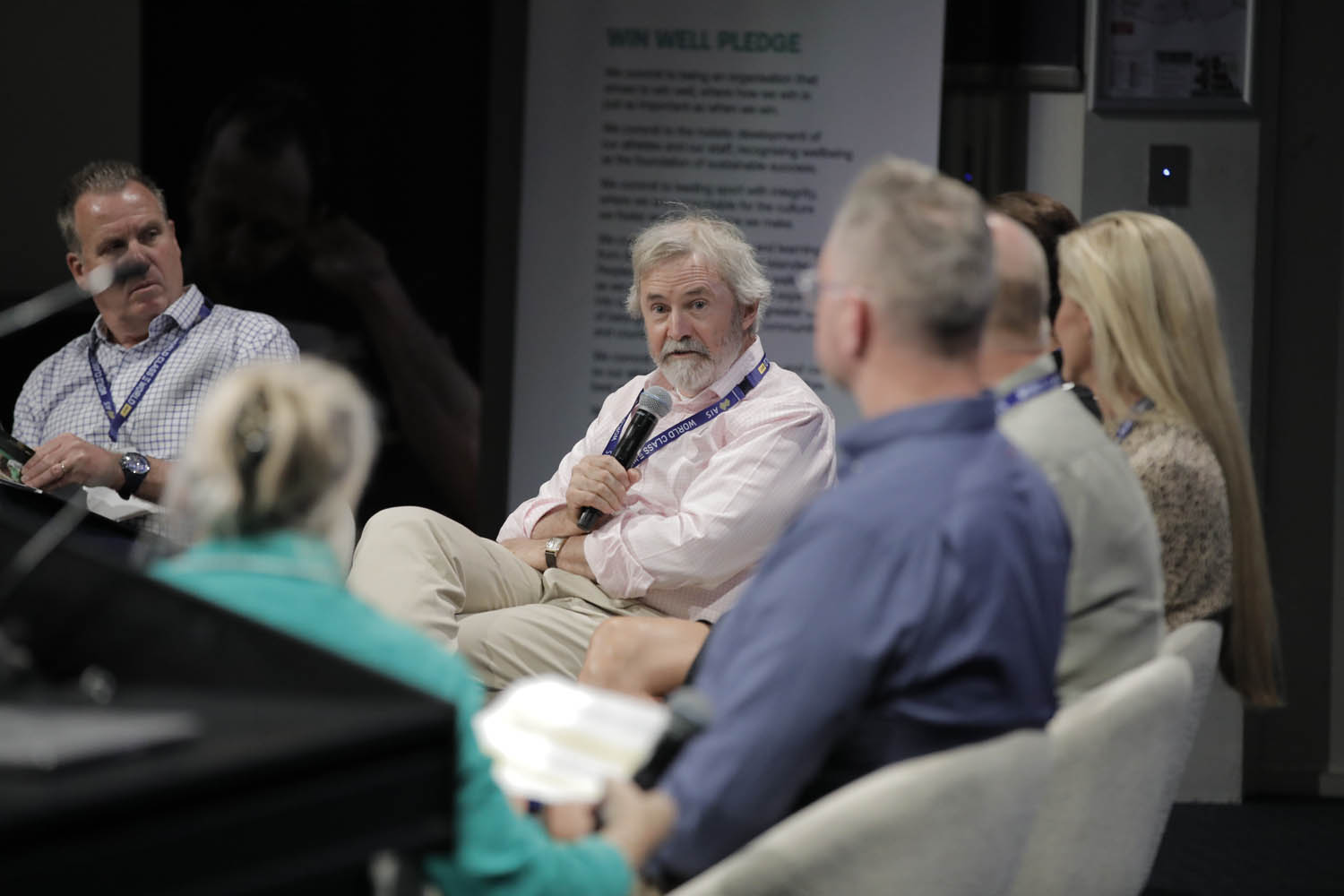 A man speaks into a microphone