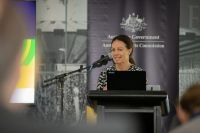 A woman standing behind a podium