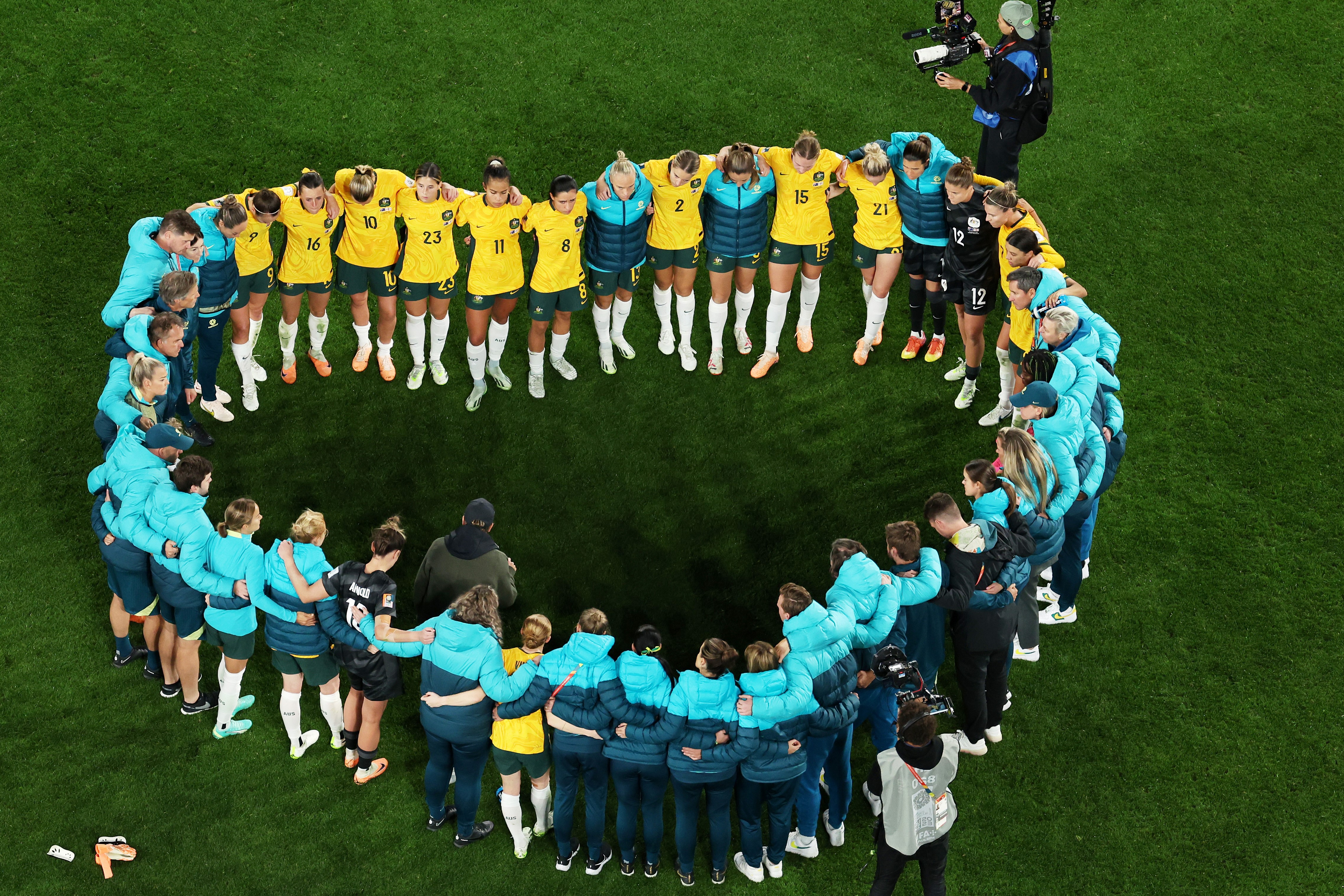 The Matildas come together in the shape of a heart after their heartbreaking semi-final loss to England in the FIFA Women's World Cup.