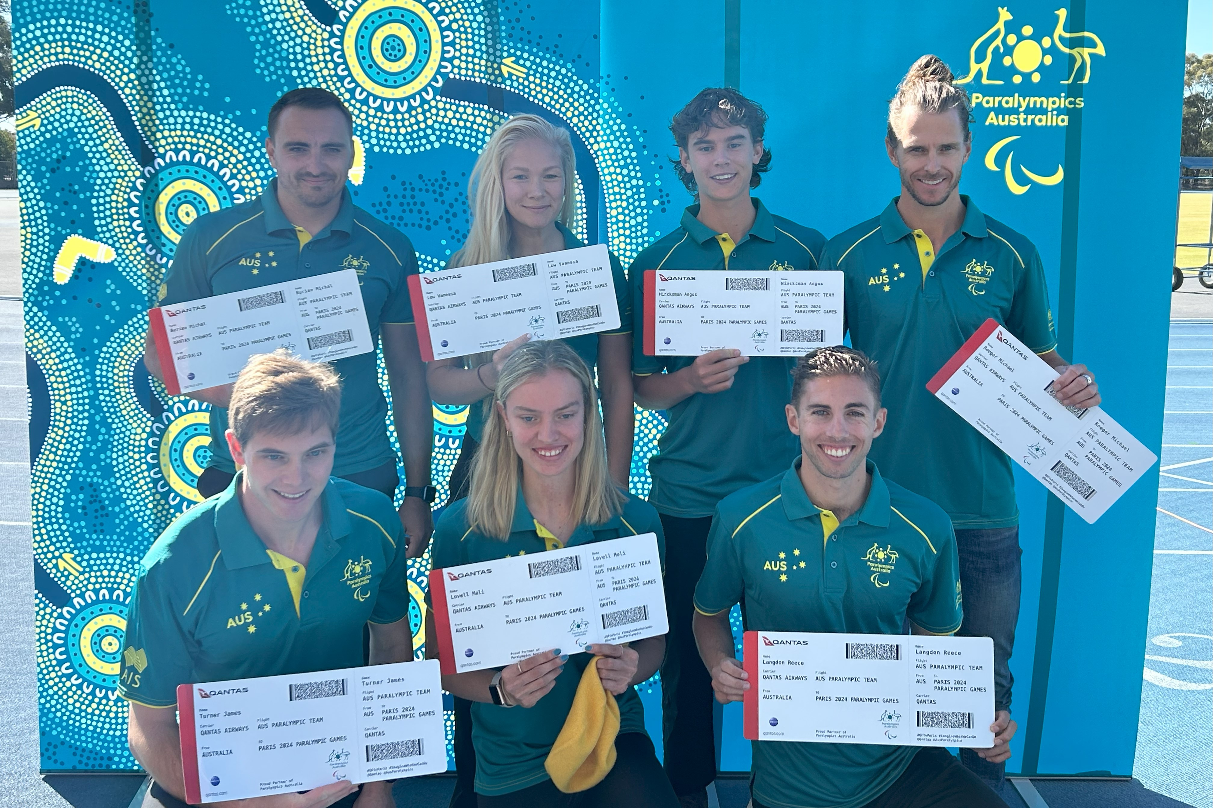 Para-athletes Michael Roeger, James Turner, Vanessa Low, Michal Burian, Mali Lovell, Angus Hincksman and Reece Langdon holding their tickets to Paris