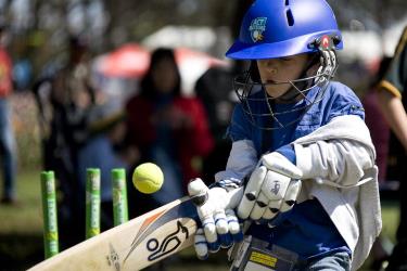 kid playing cricket