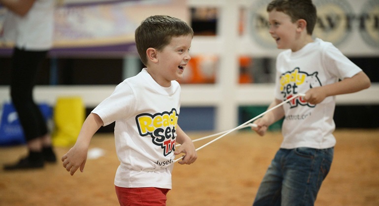 Children playing equestrian games