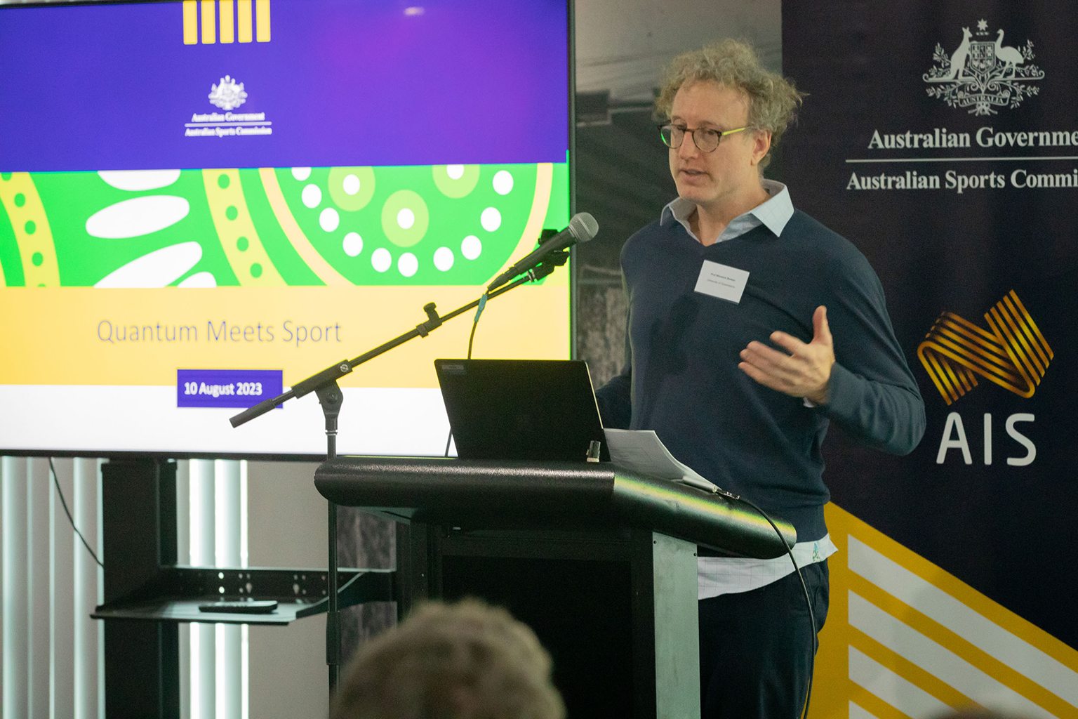 A man standing behind a podium