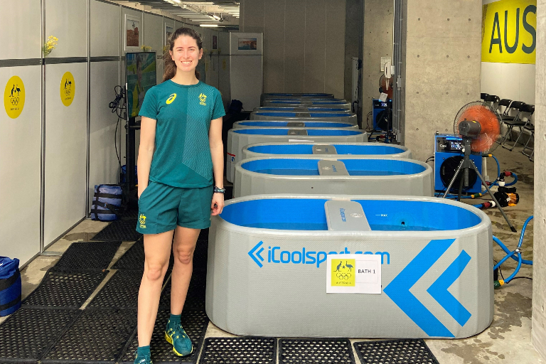 Steph standing outside ice baths at Tokyo Olympics