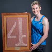 Melissa Breen with a framed piece of the AIS Track