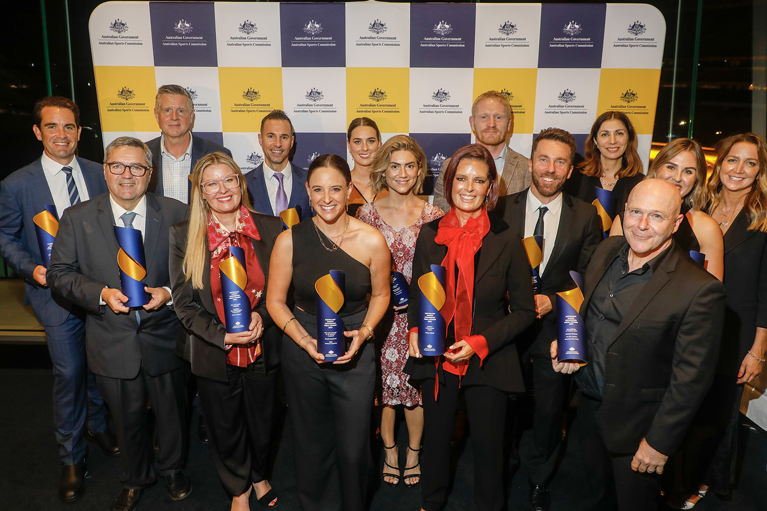 Winners with trophies at the ASC Media Awards for 2022