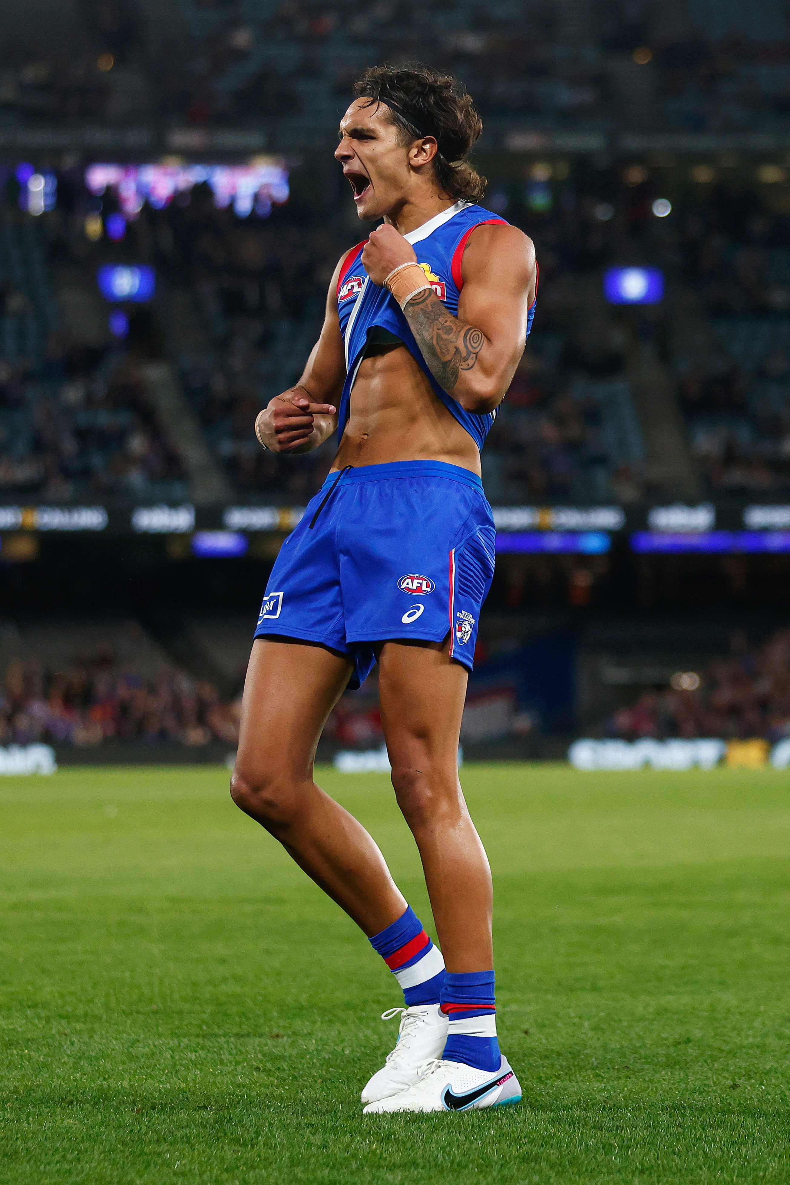 Western Bulldogs forward Jamarra Ugle-Hagan celebrates after kicking his first goal of the game by recreating Nicky Winmar’s famous stance against racism.