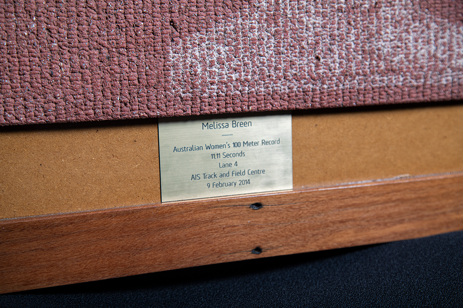 The plaque on the framed piece of AIS track given to Melissa Breen, reading 