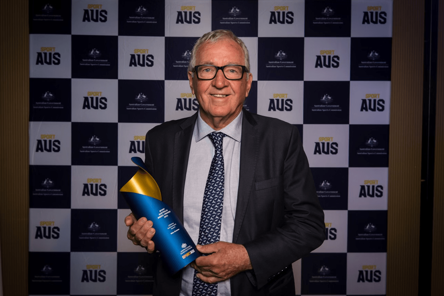 Mike Sheahan with his Sport Australia Lifetime Achievement Award