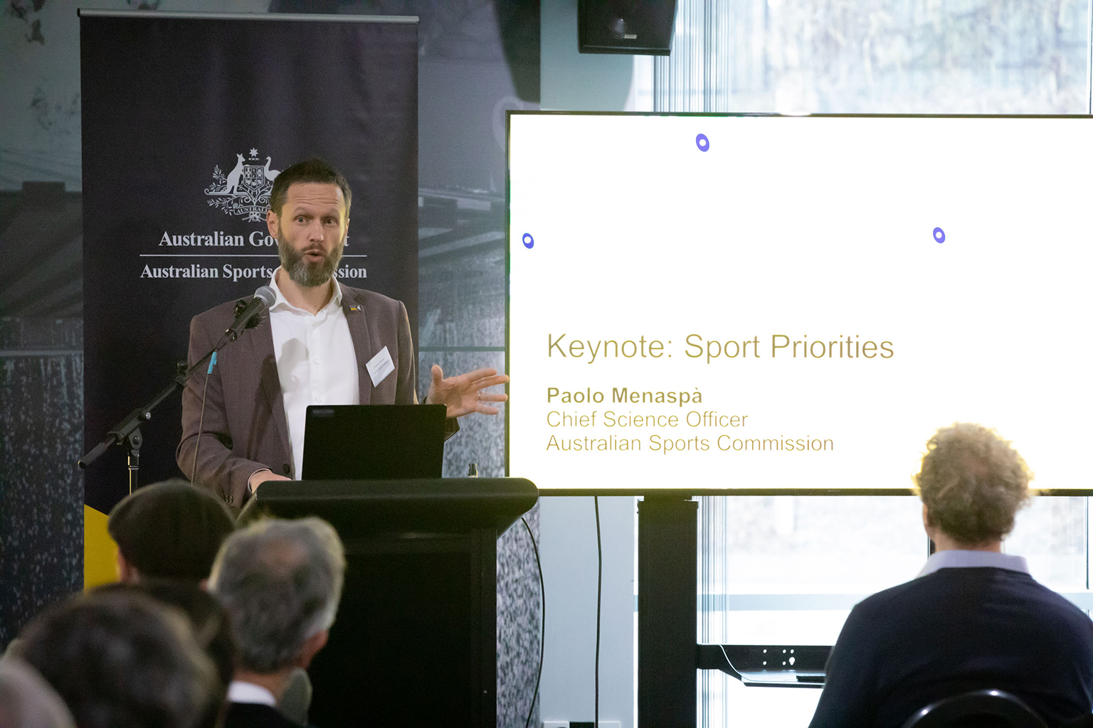 A man standing behind a podium