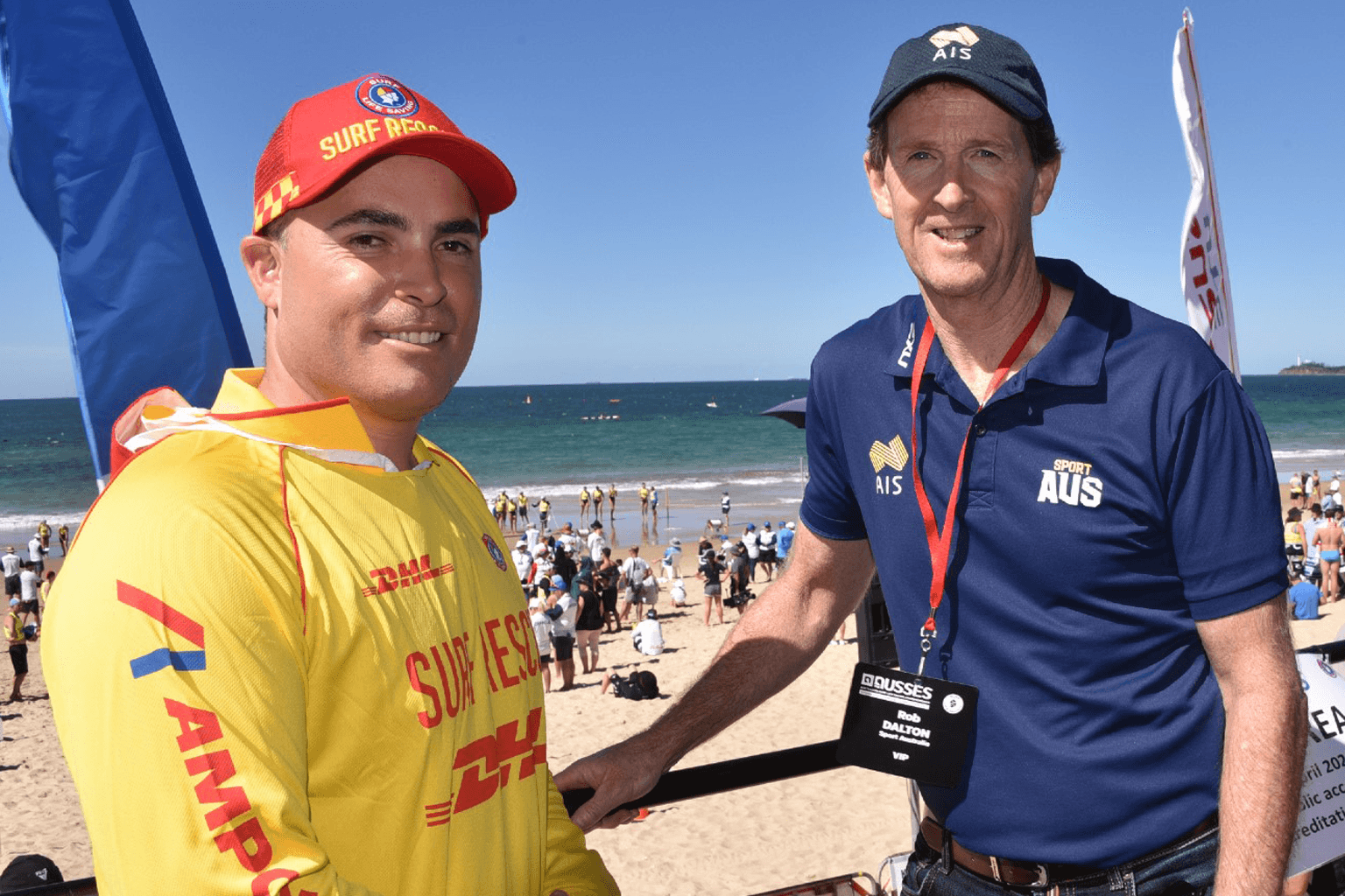 A surf life saving volunteer speaks to Rob Dalton