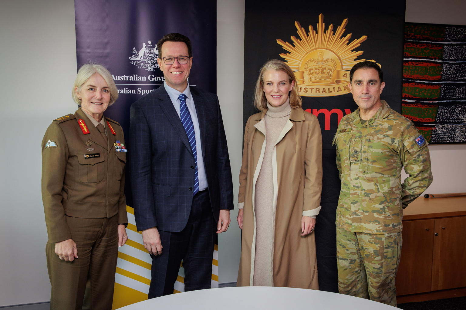 Four representatives from the Australian Army and the ASC standing together.