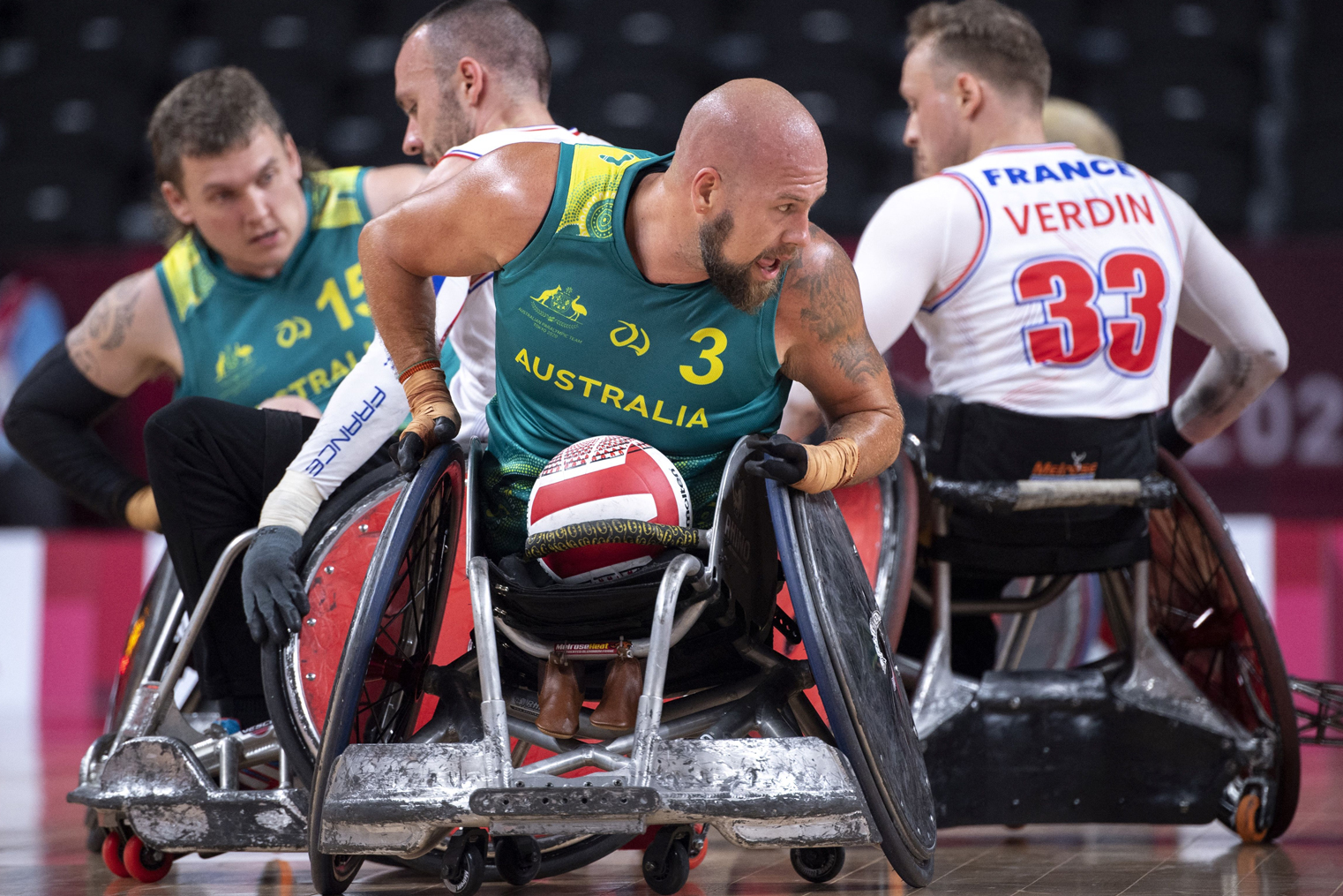 Wheelchair Rugby players contest for a ball