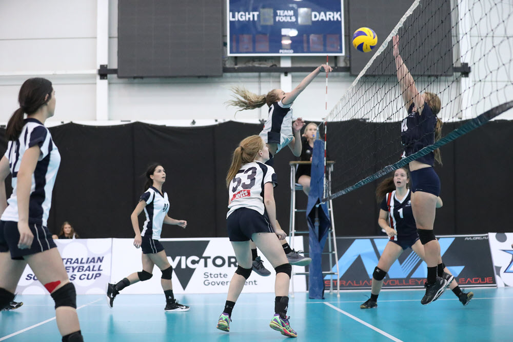 Secondary School Girls Playing Volleyball