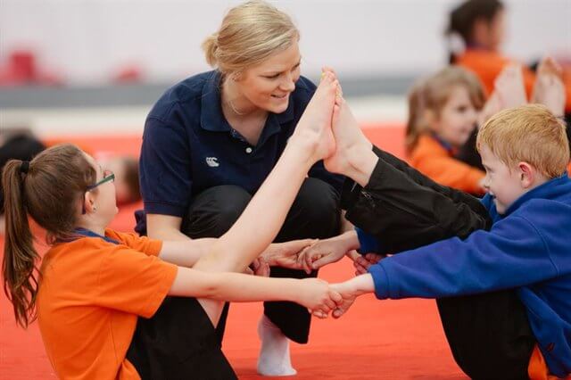 Gymnastics children with coach