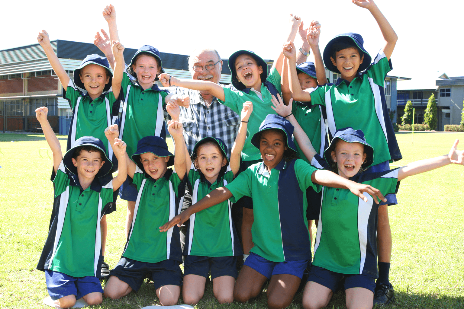 Children and a teacher cheering