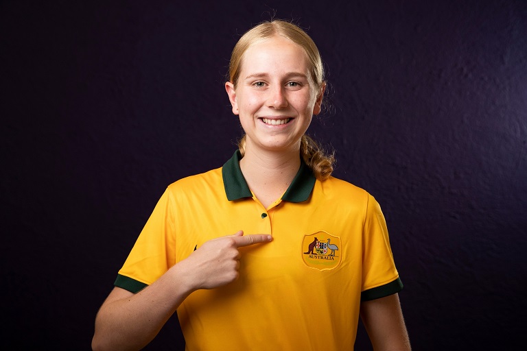 Hana Lowry points to the Australian shirt she is wearing