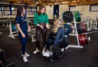 Three women in the SASI gym