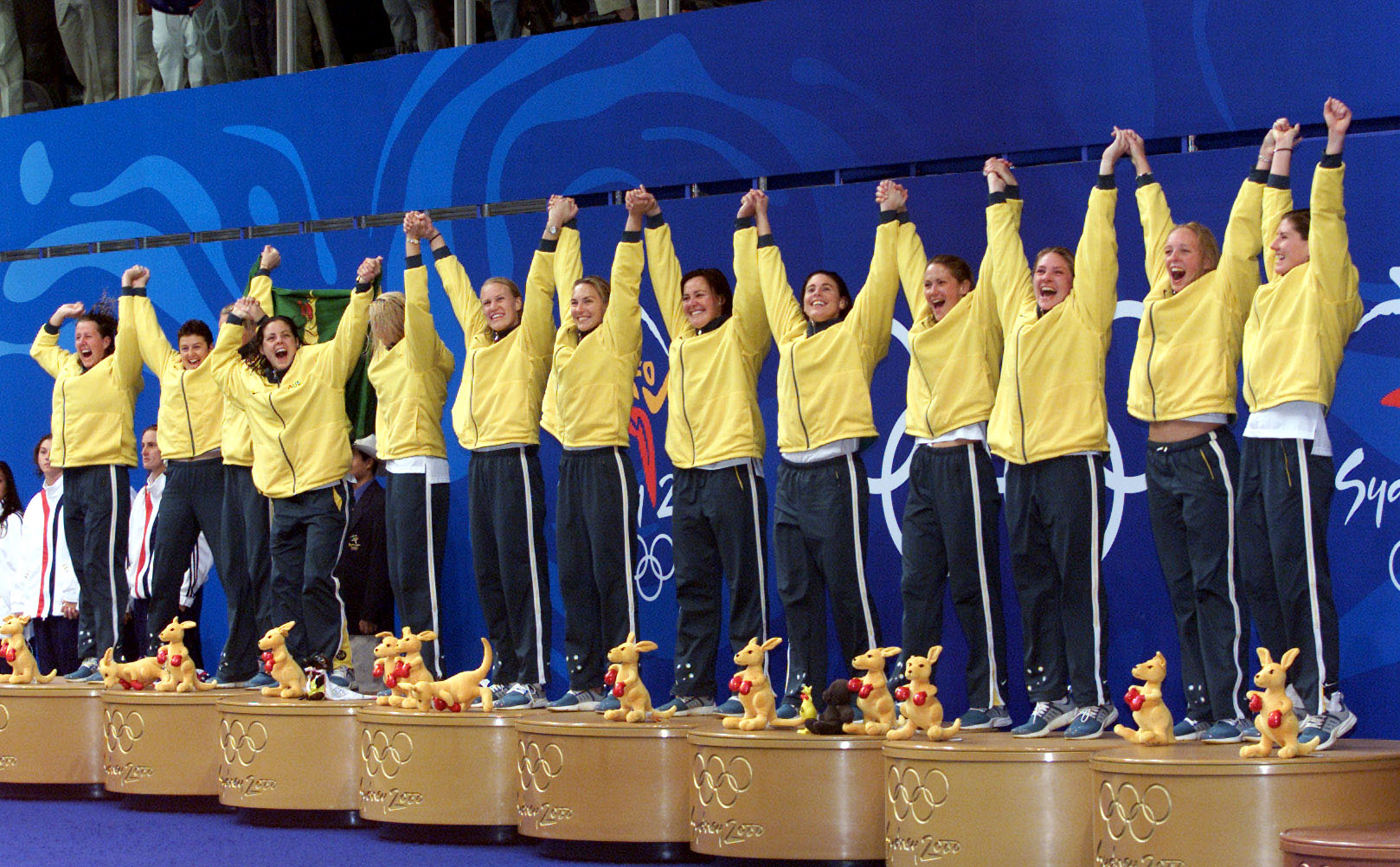 Image of the Australian Women's Water Polo team receiving their gold medal at the Sydney 2000 Olympics.