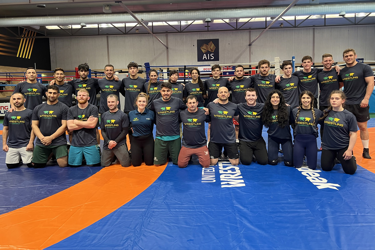 Australian Wrestling Squad stand inside AIS Combat Centre