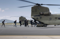 AIS representatives exit an Australian Army CH-47 Chinook on route to Townsville Field Training Area, Queensland.