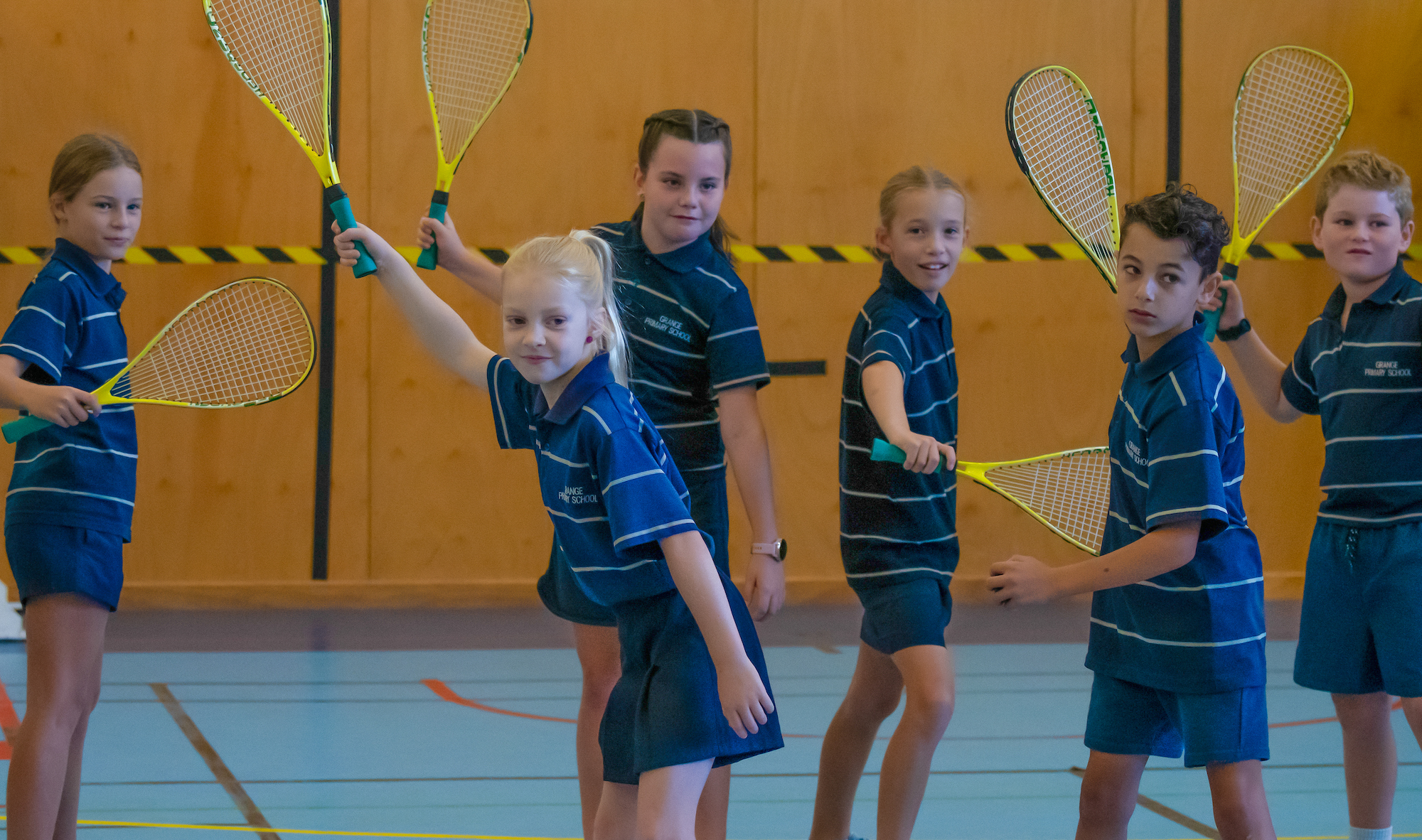 Group of students playing squash